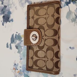 Coach retro signature cloth wallet with leather inside and trim.